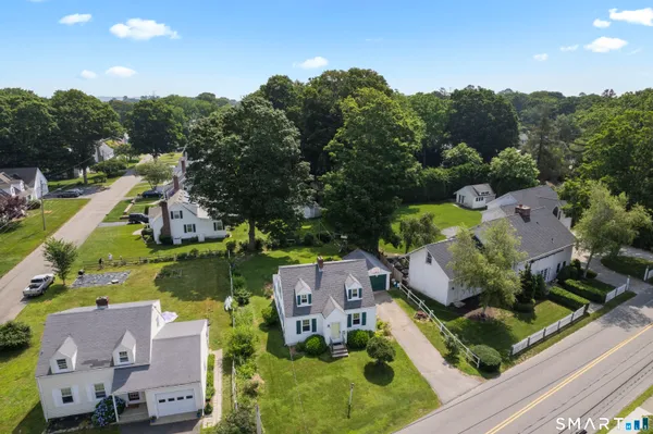 an aerial view of residential houses with outdoor space
