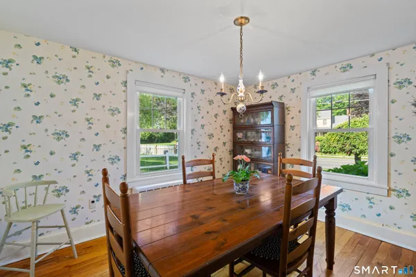 a view of a dining room with furniture window and outside view