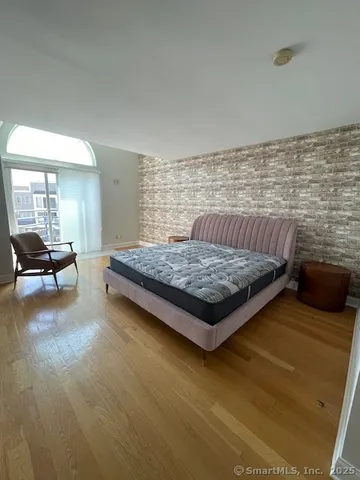 a living room with furniture rug and a table