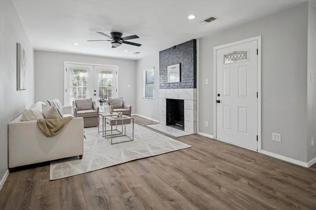 a living room with furniture and a fireplace