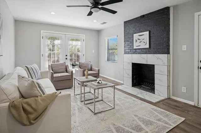 a kitchen with stainless steel appliances granite countertop a refrigerator sink and stove