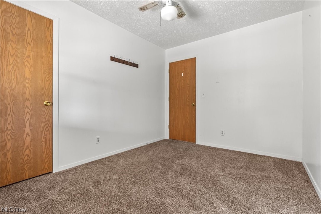 1827 Barth Road Belpre, OH 45714 - Photo 21 of 31 Carpeted spare room with a textured ceiling