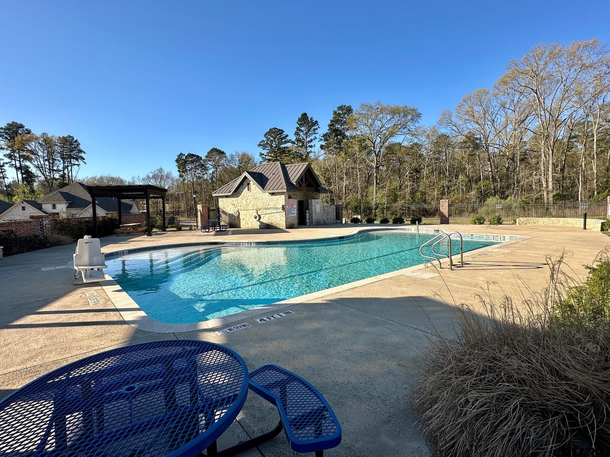 9291 Caddo Rdg Cove Tyler, TX 75703 - Photo 10 of 13 a view of a yard and front view of a house