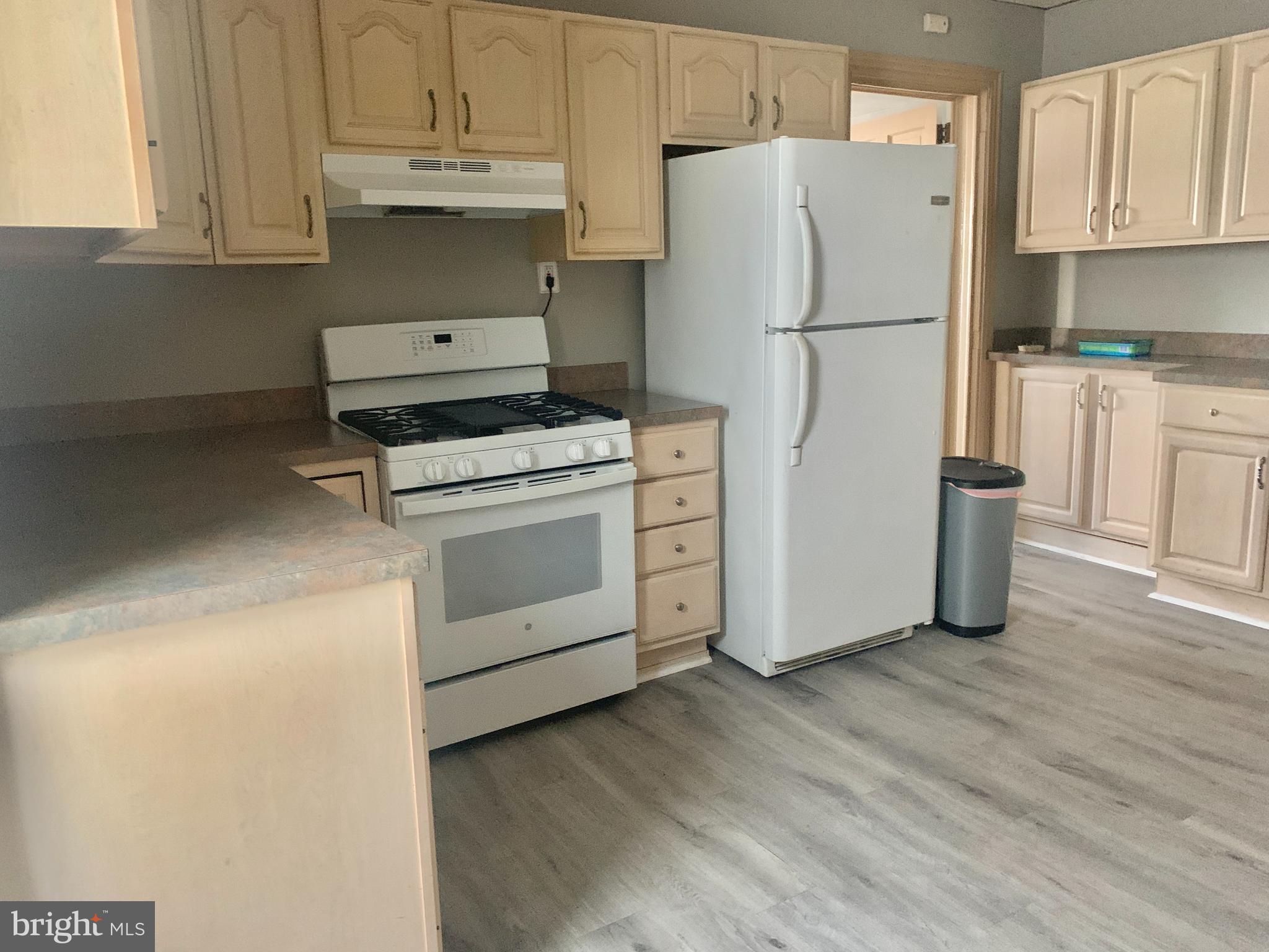 340 Main Street, Unit FIRST Royersford, PA 19468 - Photo 5 of 10 a white refrigerator freezer sitting inside of a kitchen