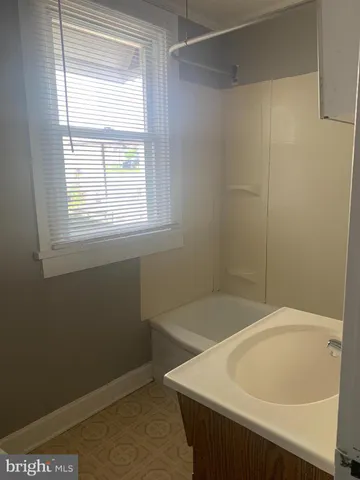a bathroom with a sink and a bathtub