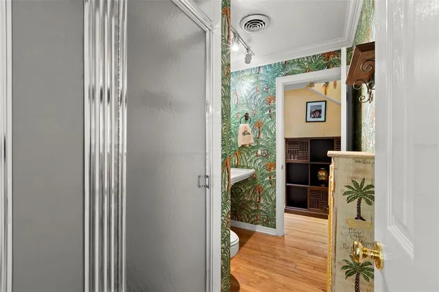 a bedroom with a bed dresser and a window