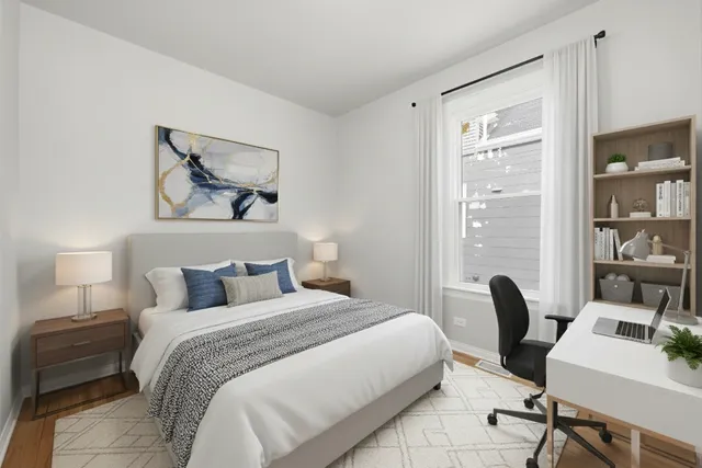 a view of an empty room with closet and window