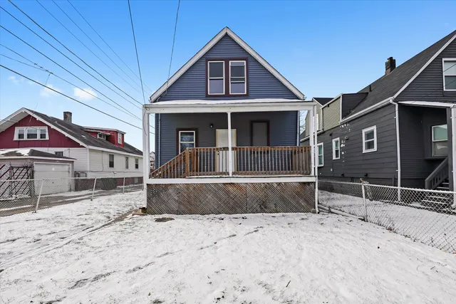 a view of a house with a snow in the yard