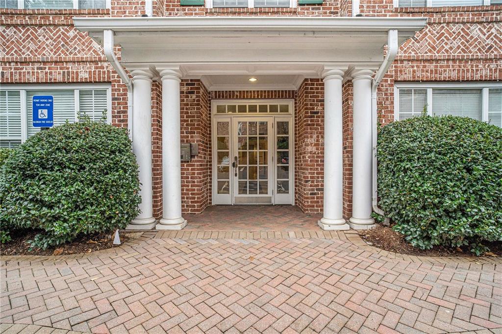 1204 Stratford Commons Decatur, GA 30033 - Photo 1 of 1 front view of a brick house with a large window