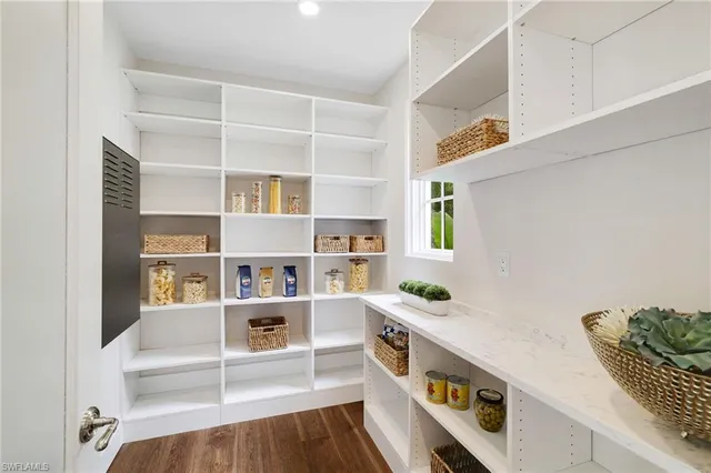 a view of an entryway with wooden floor
