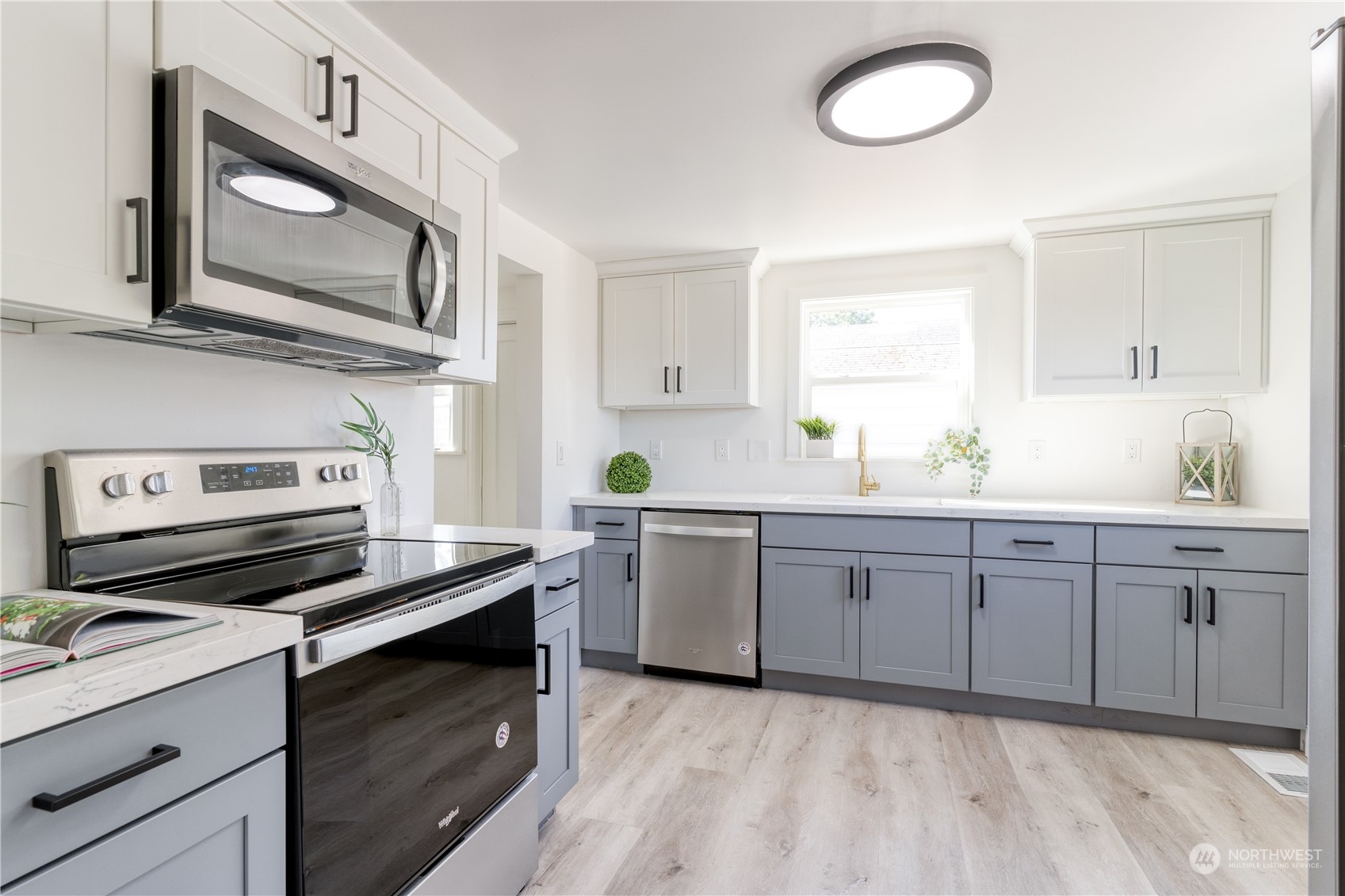 3749 Southwest Monroe Street Seattle, WA 98126 - Photo 12 of 25 a kitchen with cabinets appliances and a window