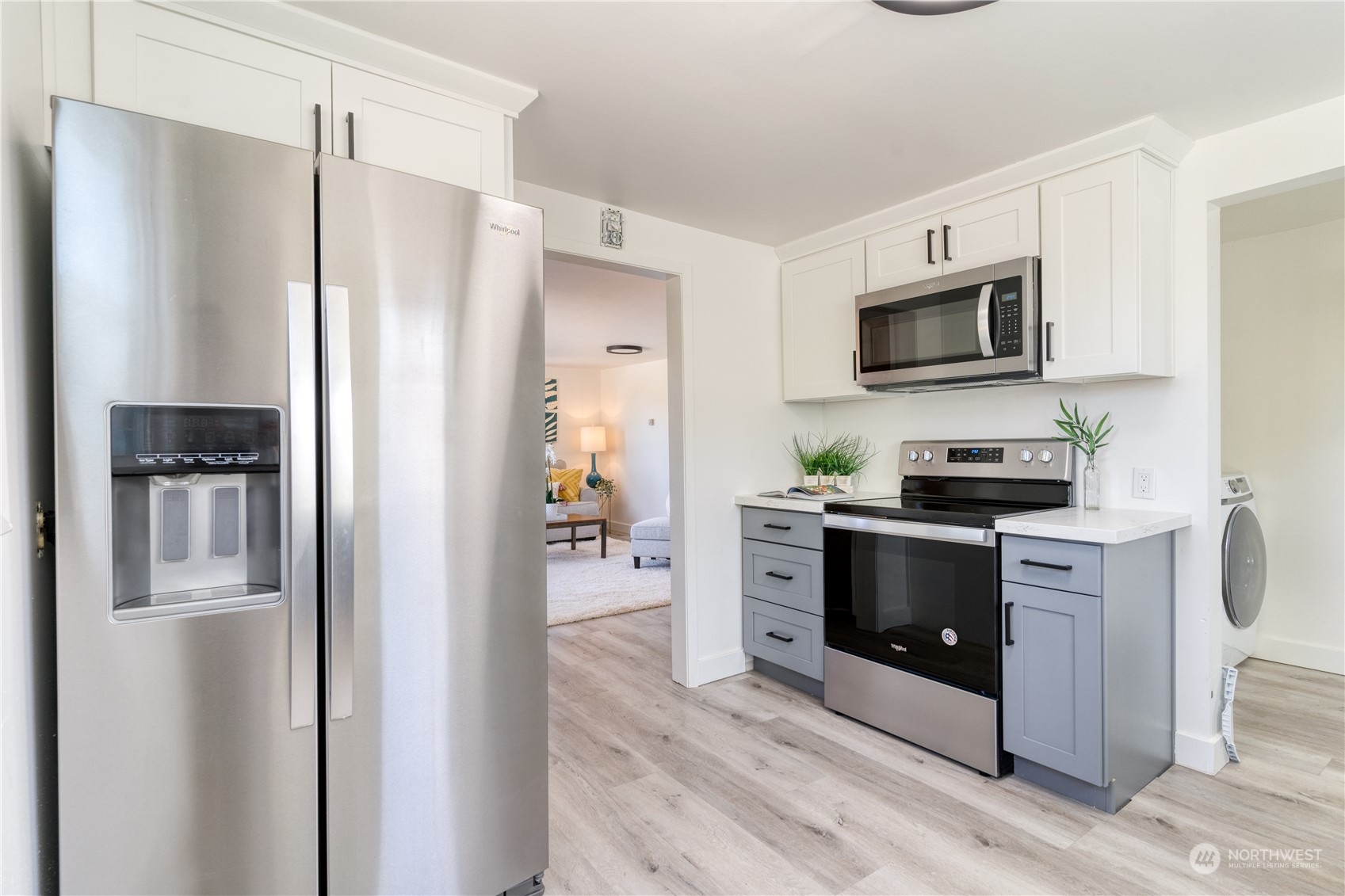 3749 Southwest Monroe Street Seattle, WA 98126 - Photo 15 of 25 a kitchen with stainless steel appliances a refrigerator stove and microwave