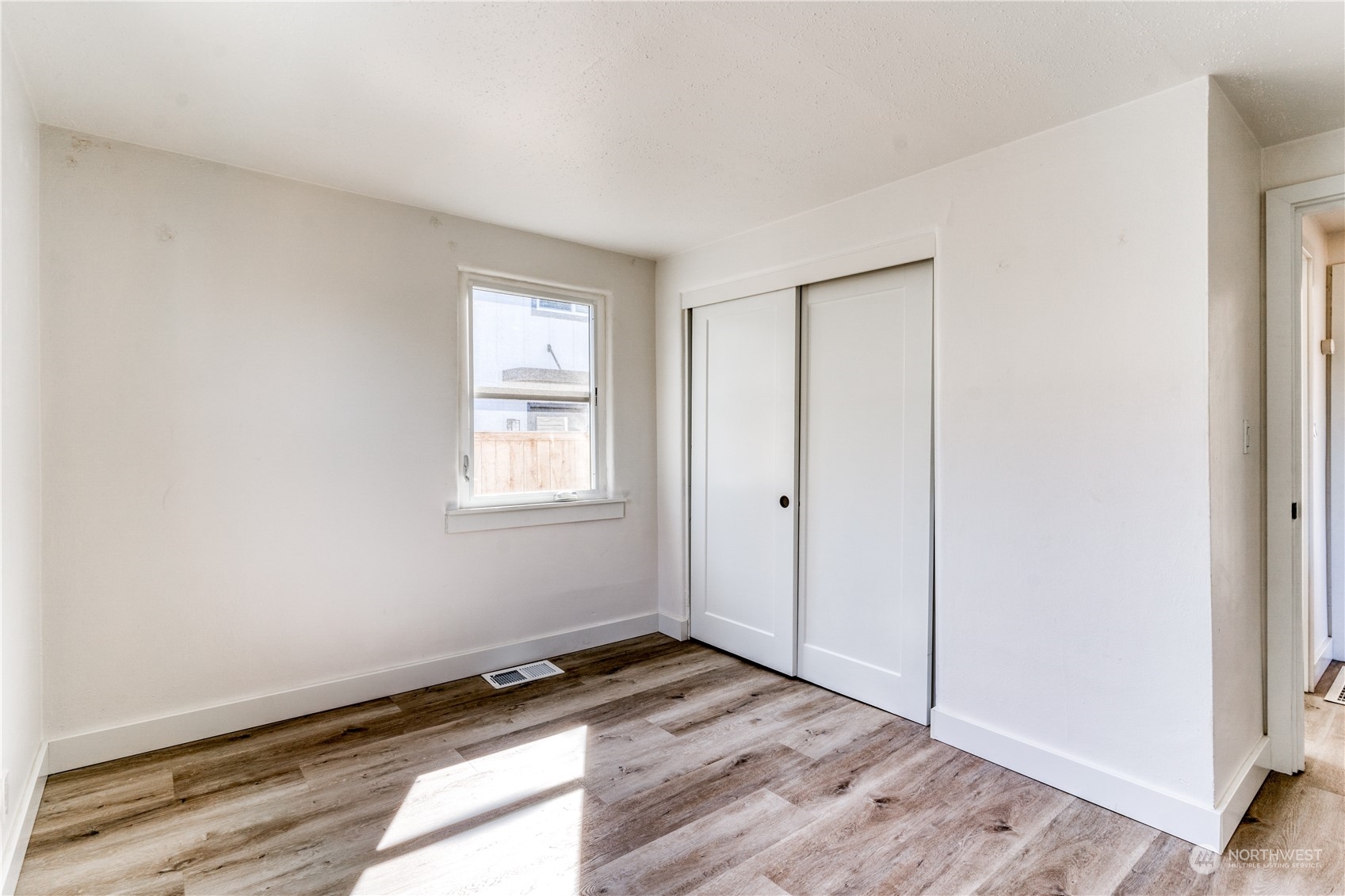 3749 Southwest Monroe Street Seattle, WA 98126 - Photo 8 of 25 a view of an empty room and window