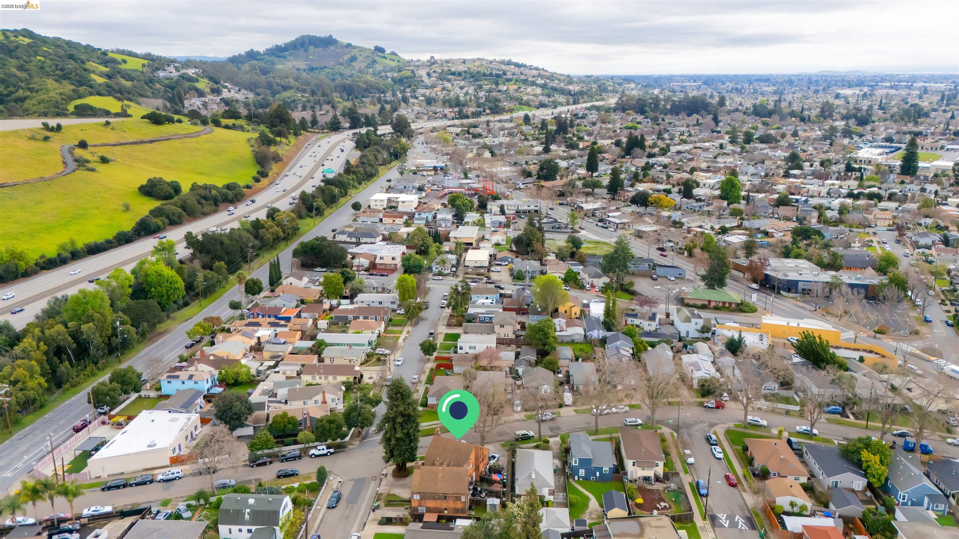 10933 Julius Street, Unit D Oakland, CA 94605 - Photo 28 of 28 an aerial view of ocean and residential houses with outdoor space