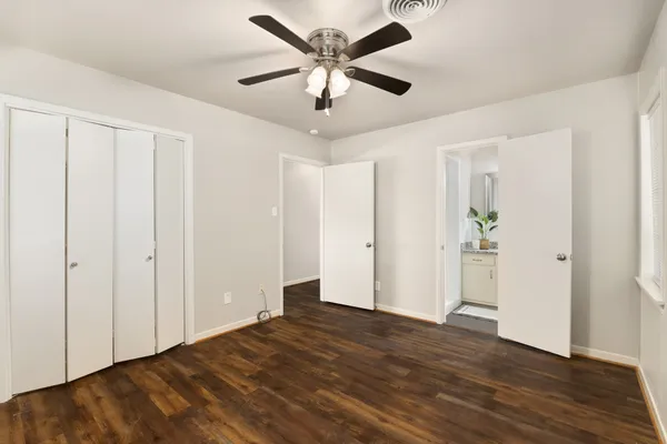 a view of an empty room and wooden floor