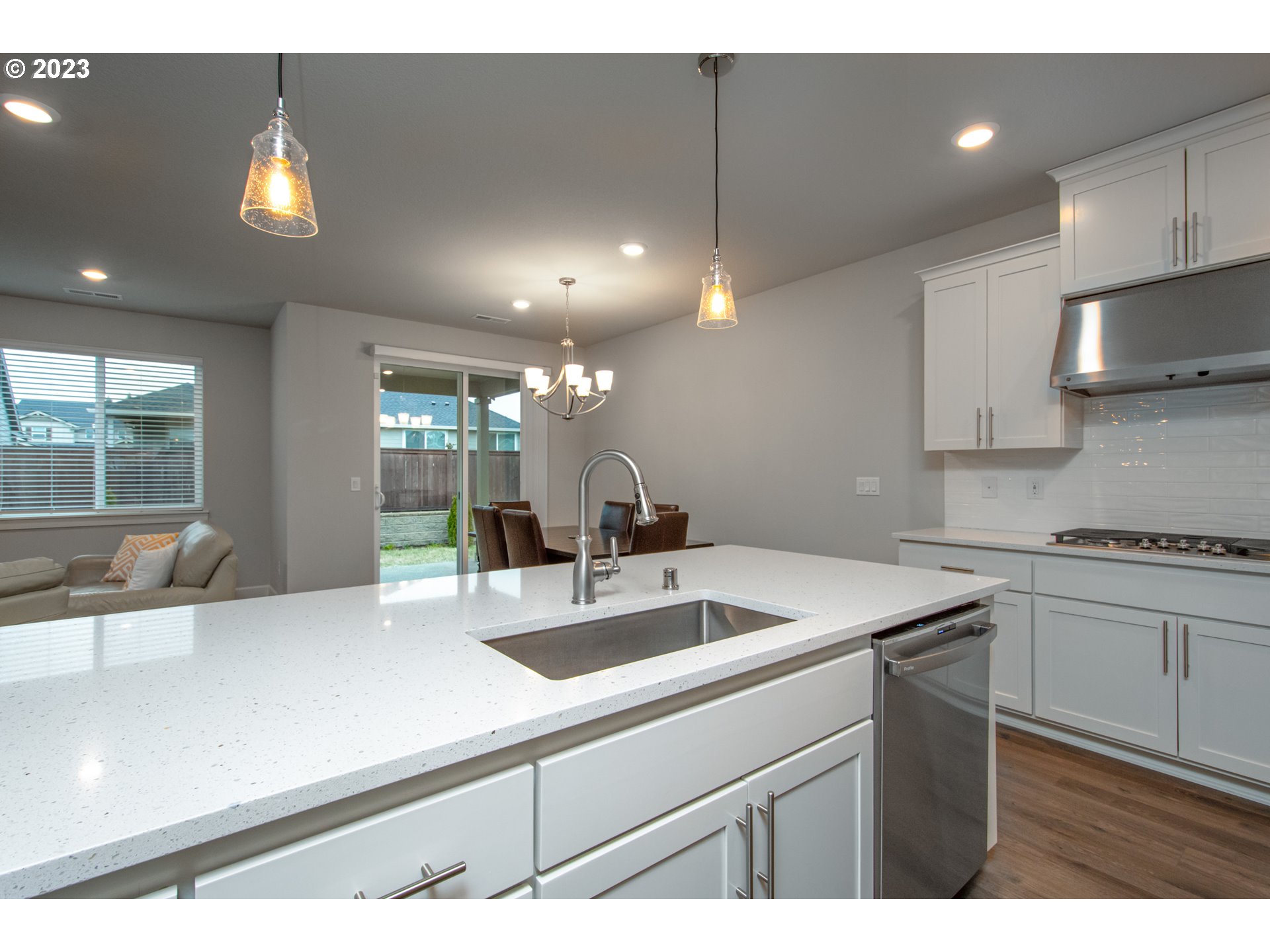 4916 South 17th Drive Ridgefield, WA 98642 - Photo 10 of 26 a kitchen with a sink a counter top space cabinets and stainless steel appliances