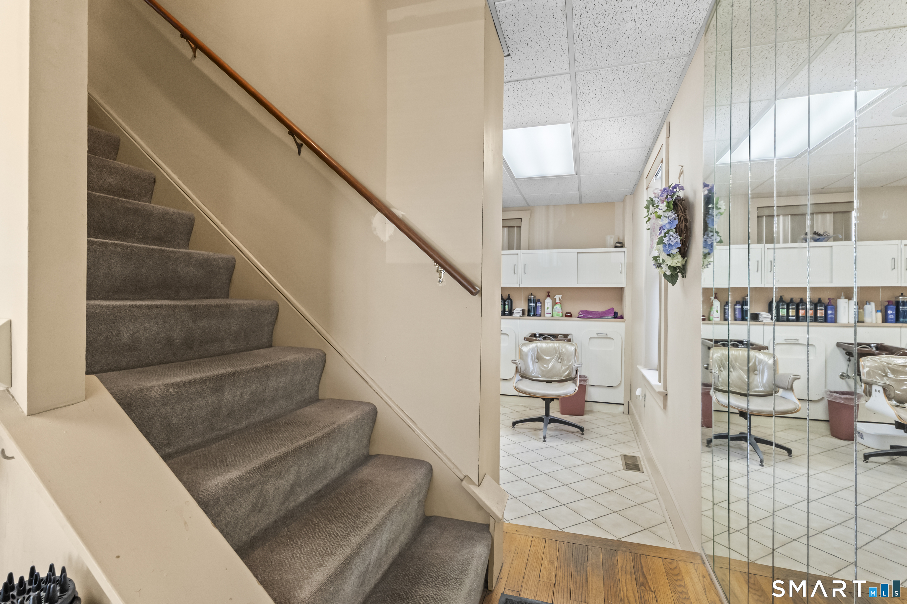 506 Old Stratfield Road Fairfield, CT 06825 - Photo 10 of 23 Staircase to upper level, was rented out for 20 yrs for skin care and nail rooms, can make separate entrance for apartment . Check with town.