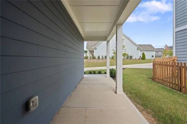 a view of a swimming pool with outdoor seating