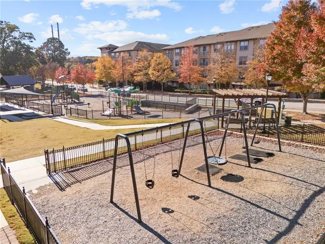 a view of a swimming pool and an outdoor seating