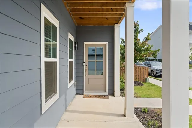 a view of staircase with wooden floor and a potted plant