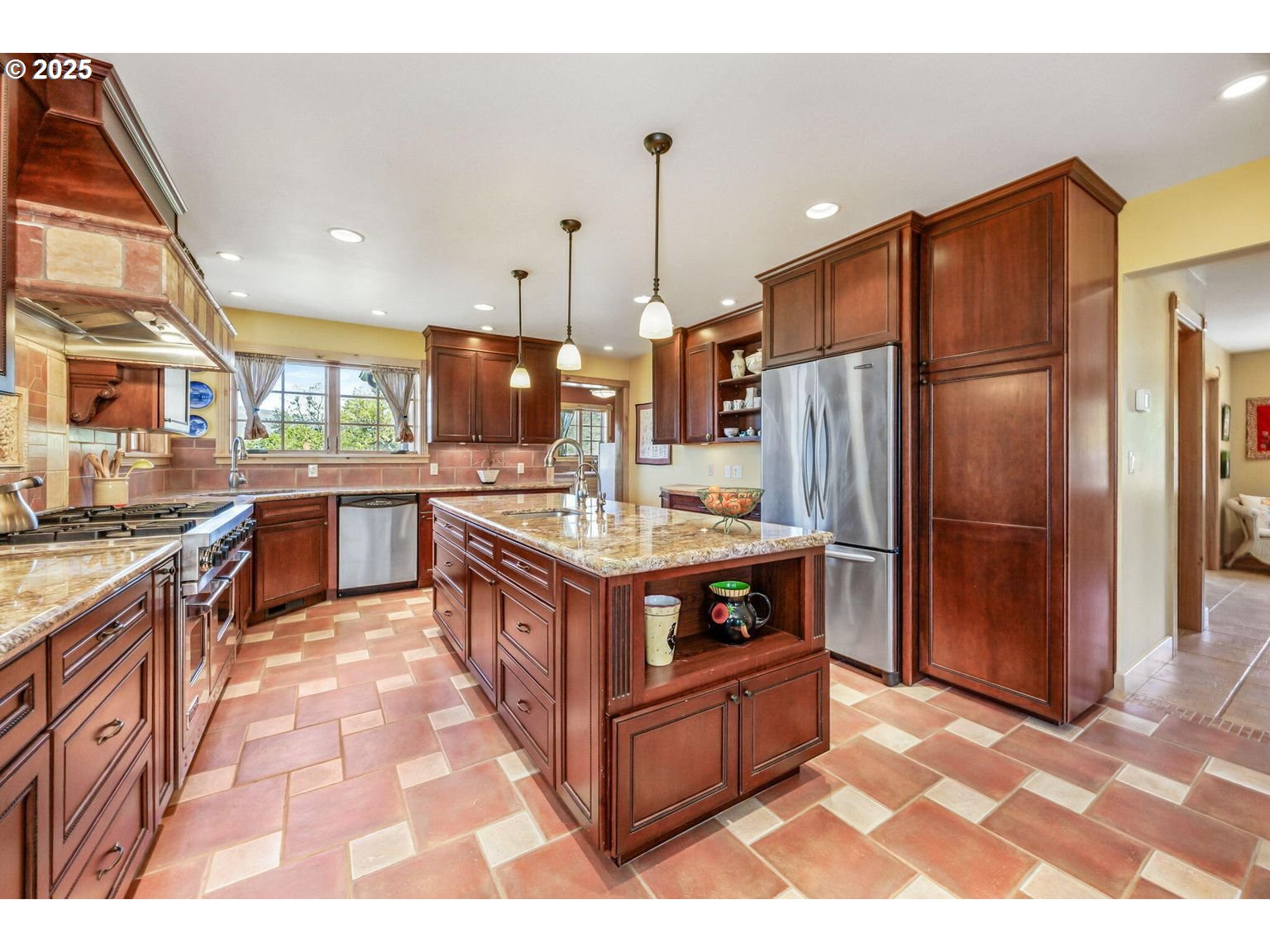 2816 Quail Run Road Talent, OR 97540 - Photo 13 of 43 a kitchen with stainless steel appliances granite countertop a stove a sink and a refrigerator
