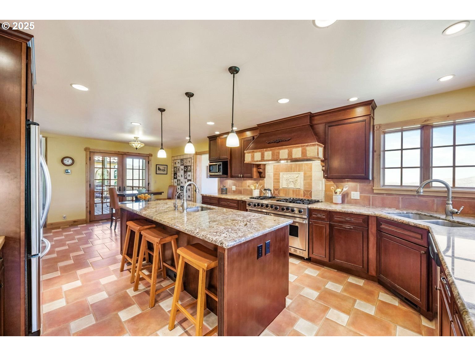 2816 Quail Run Road Talent, OR 97540 - Photo 16 of 43 a large kitchen with lots of counter space a sink and appliances