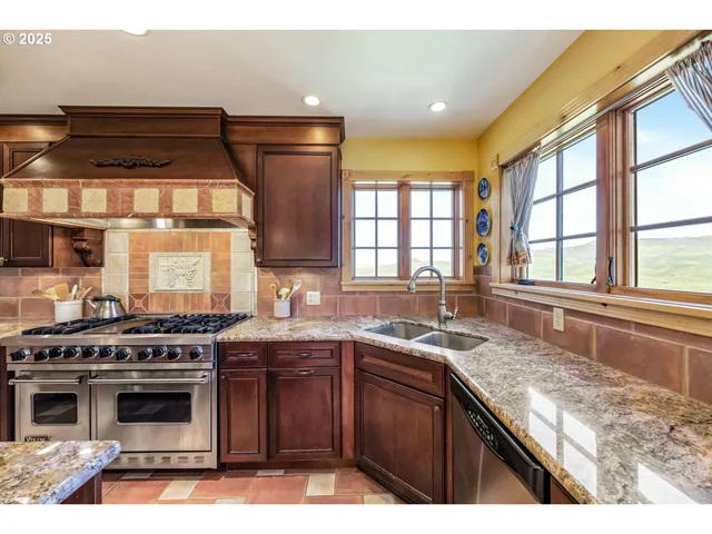 a view of a dining room with furniture a chandelier and wooden floor