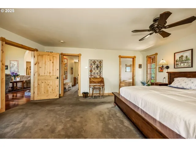 a bedroom with a bed and dresser