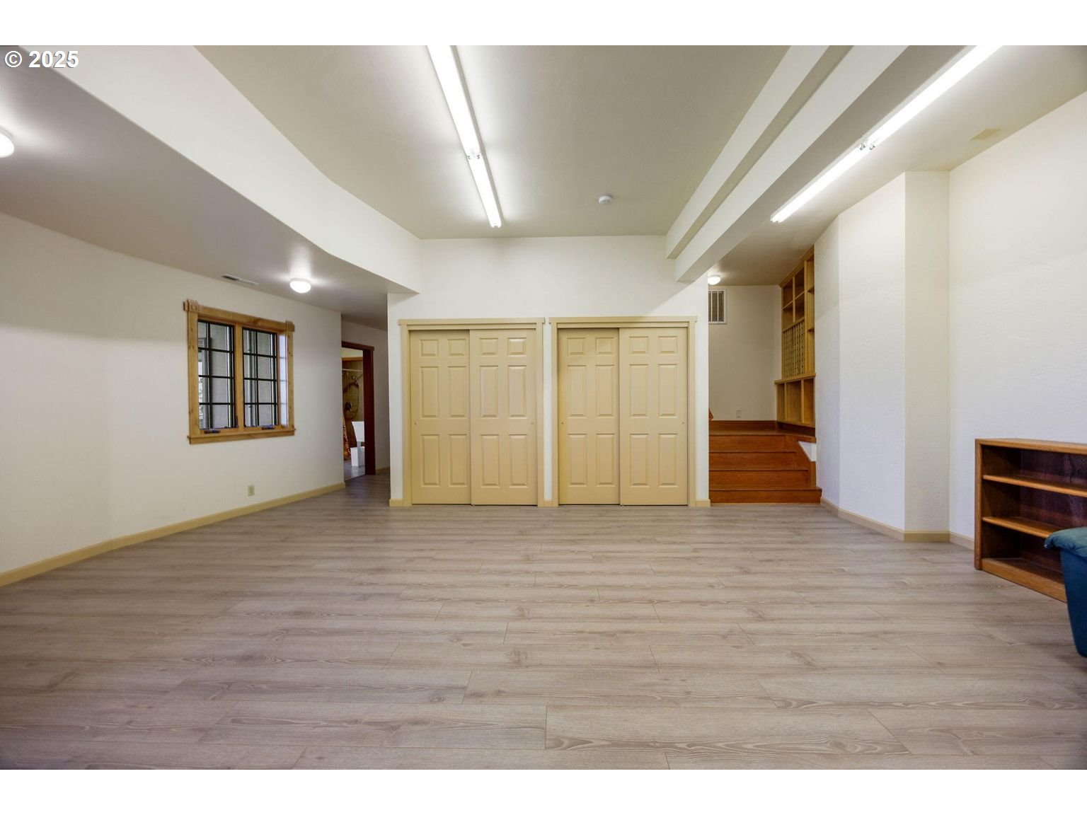 2816 Quail Run Road Talent, OR 97540 - Photo 33 of 43 a view of an empty room with wooden floor and a window