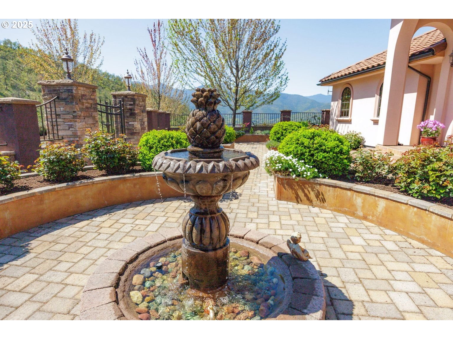 2816 Quail Run Road Talent, OR 97540 - Photo 8 of 43 a front view of a house with a yard and fountain