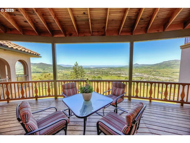 a kitchen with stainless steel appliances granite countertop a stove a sink dishwasher a refrigerator and a oven with wooden floor