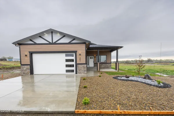 front view of a house with a yard