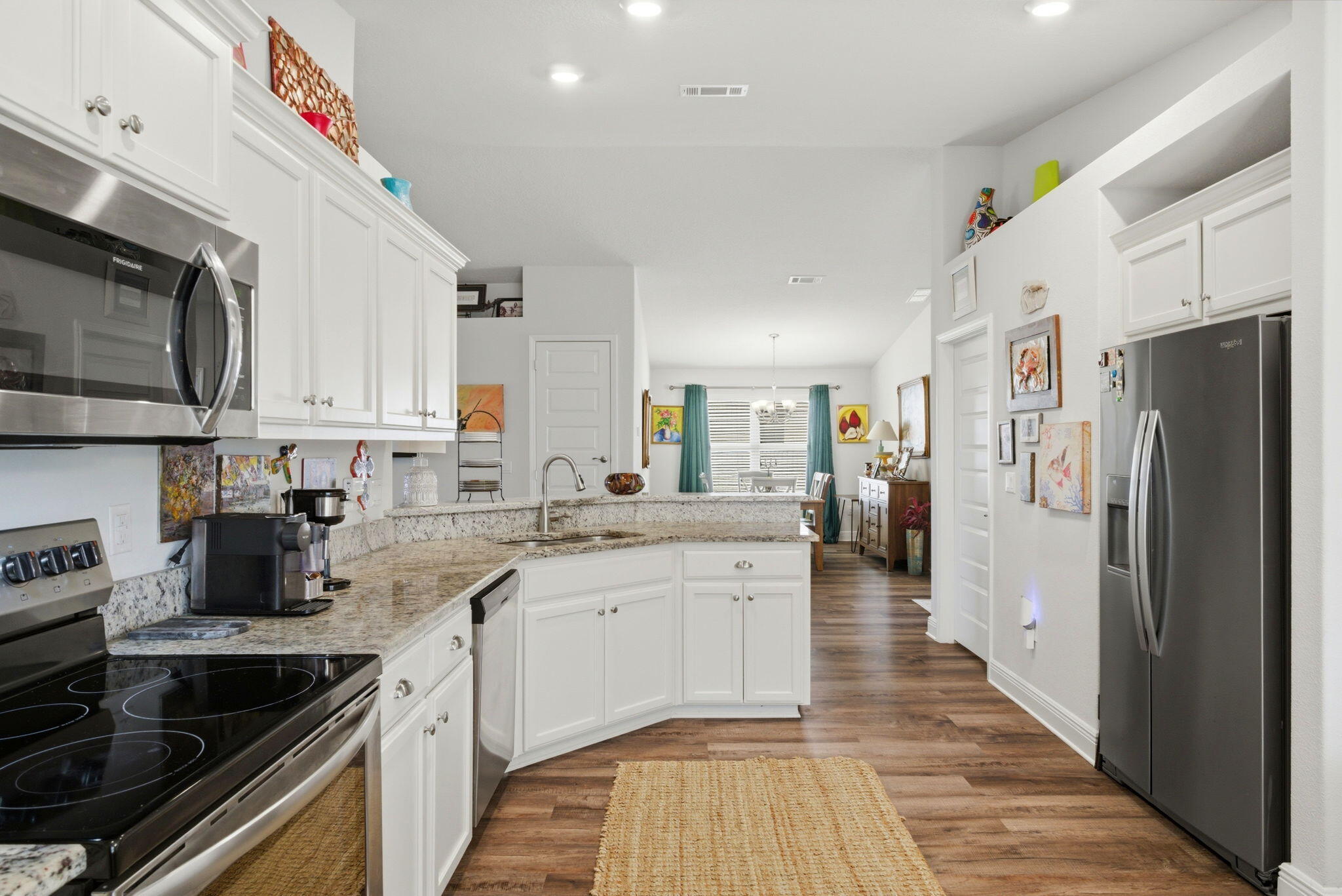 142 Ridgeway Circle Crestview, FL 32536 - Photo 13 of 41 a kitchen with stainless steel appliances a sink stove refrigerator and cabinets