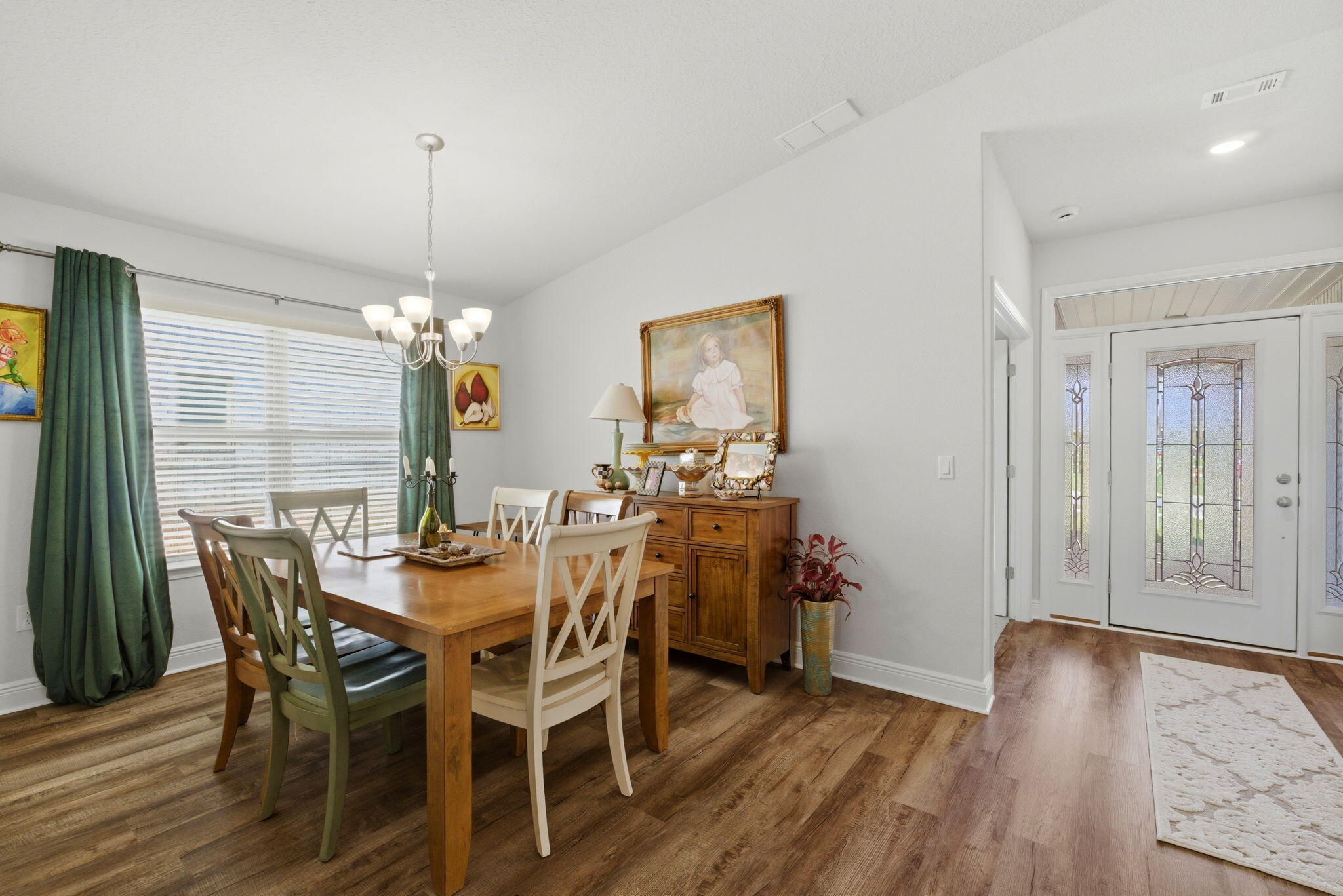 142 Ridgeway Circle Crestview, FL 32536 - Photo 18 of 41 a view of a dining room with furniture window and wooden floor