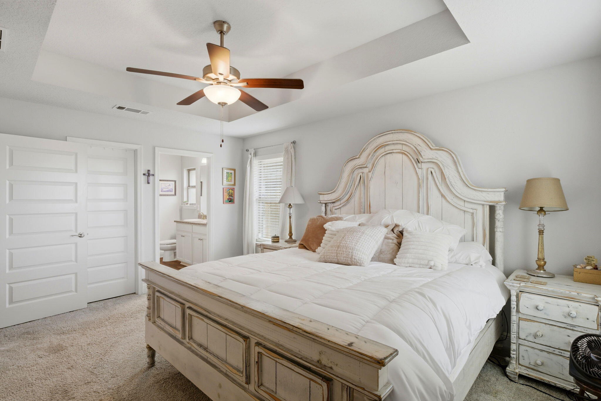 142 Ridgeway Circle Crestview, FL 32536 - Photo 24 of 41 a bedroom with a bed and a chandelier