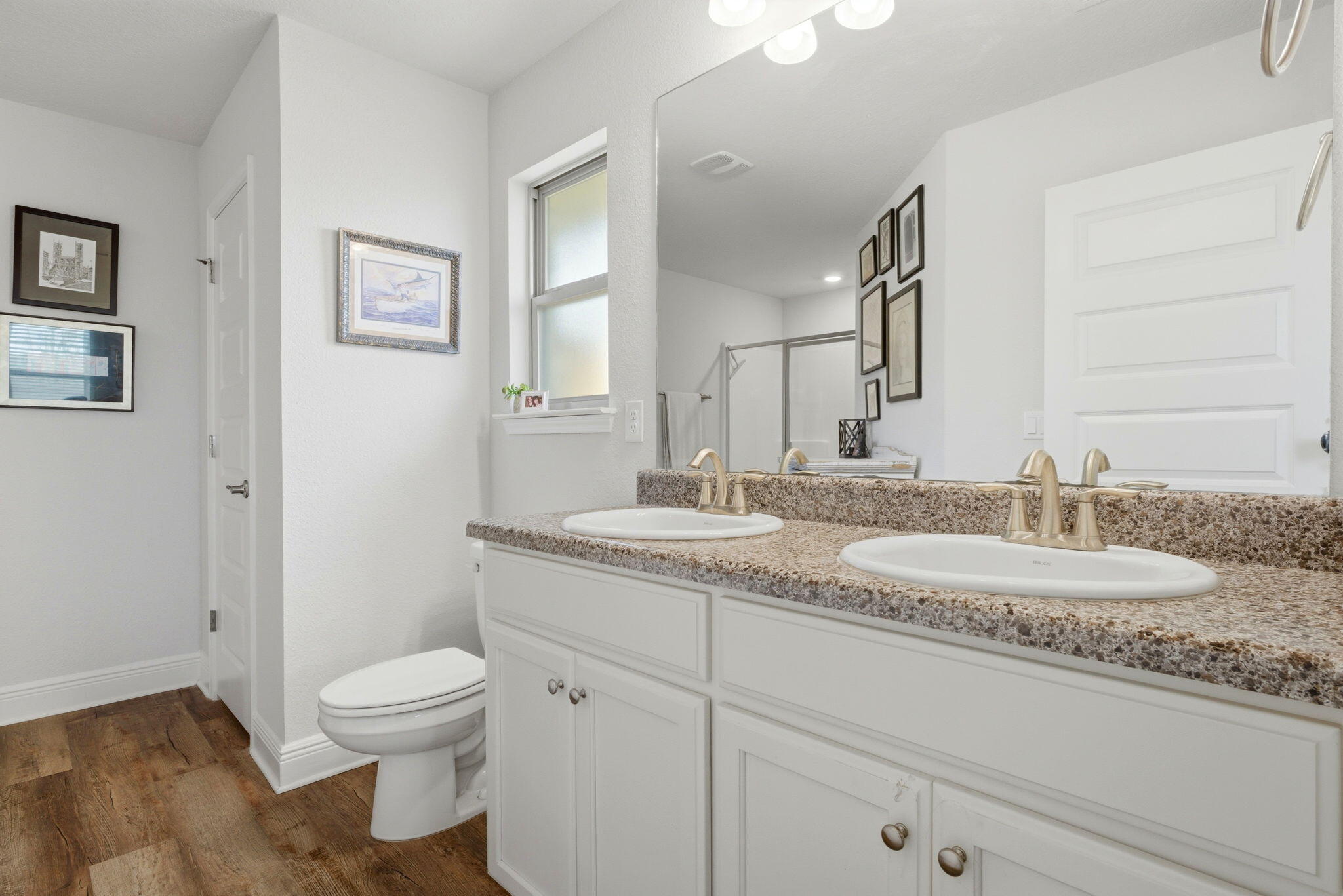 142 Ridgeway Circle Crestview, FL 32536 - Photo 27 of 41 a bathroom with a granite countertop sink a toilet and a mirror