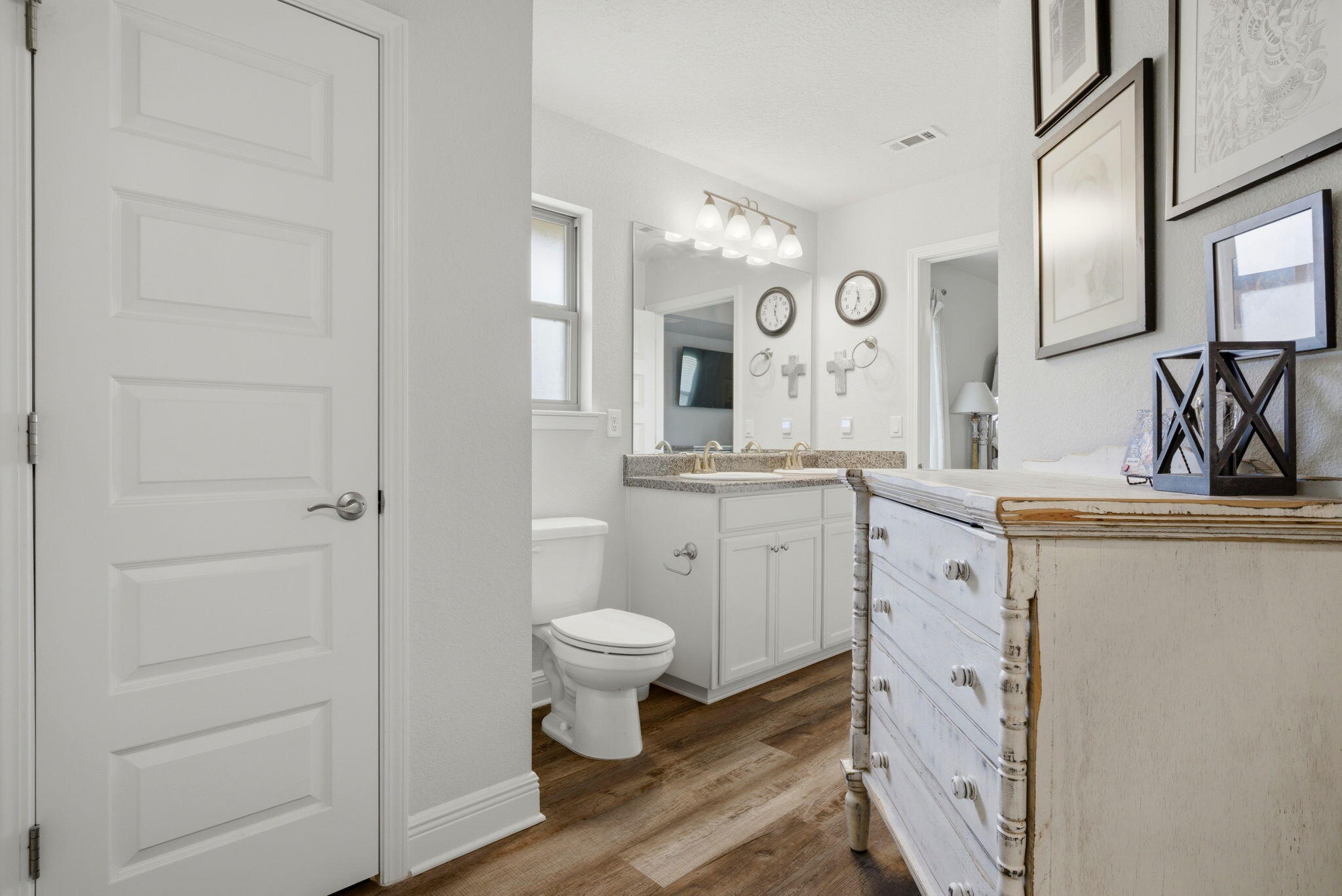 142 Ridgeway Circle Crestview, FL 32536 - Photo 29 of 41 a bathroom with a toilet sink a mirror a vanity and window