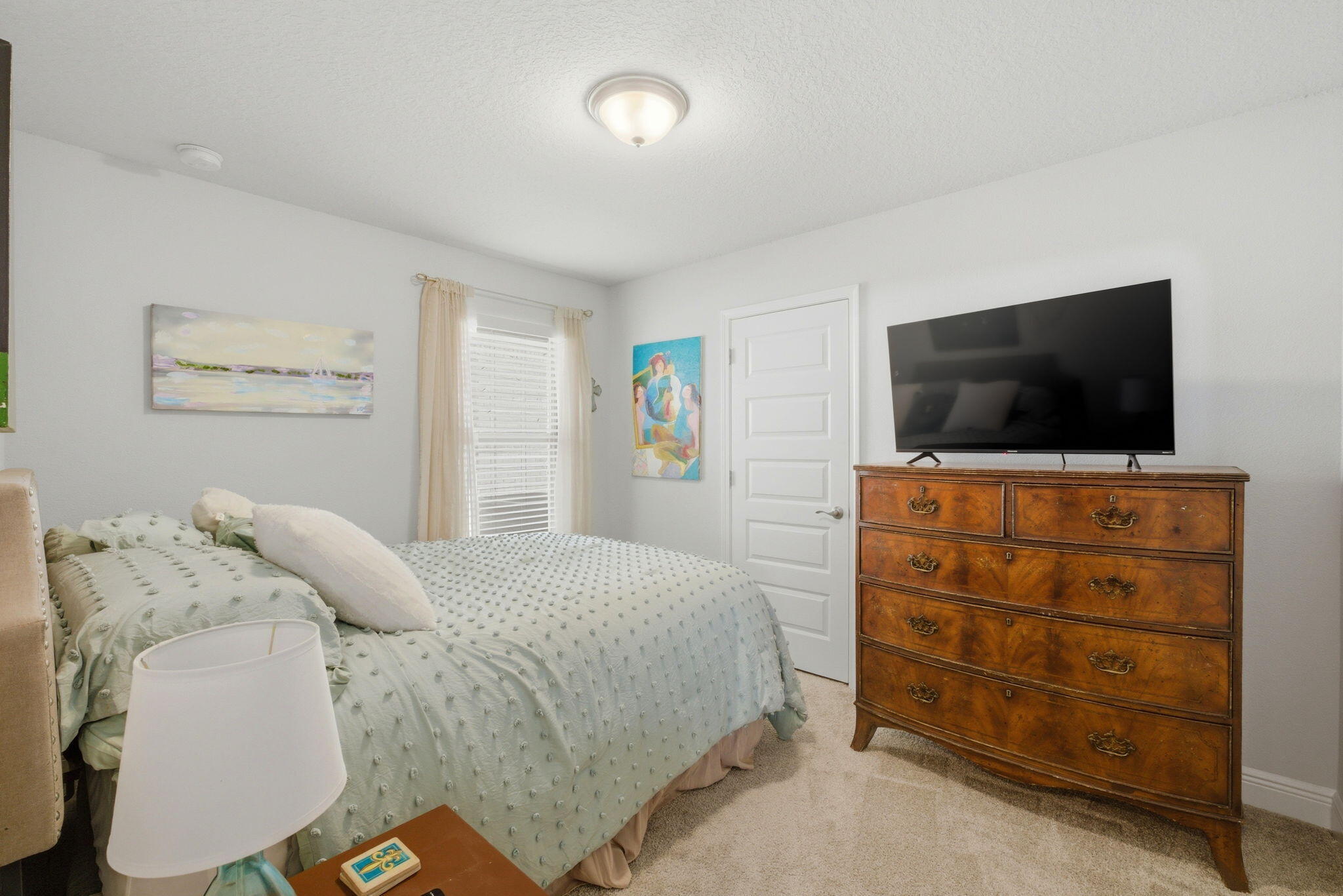 142 Ridgeway Circle Crestview, FL 32536 - Photo 30 of 41 a bedroom with a bed and a flat screen tv