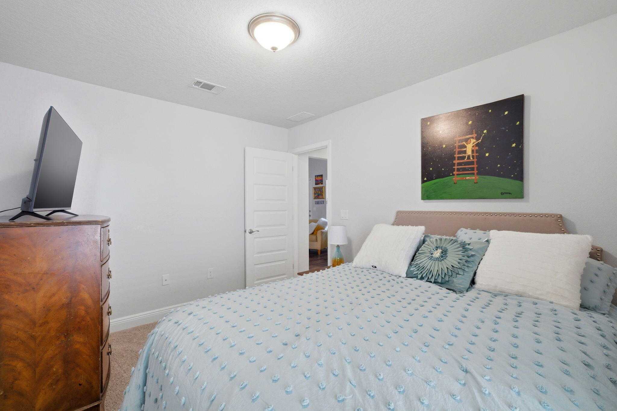 142 Ridgeway Circle Crestview, FL 32536 - Photo 32 of 41 a bedroom with a bed and a flat screen tv