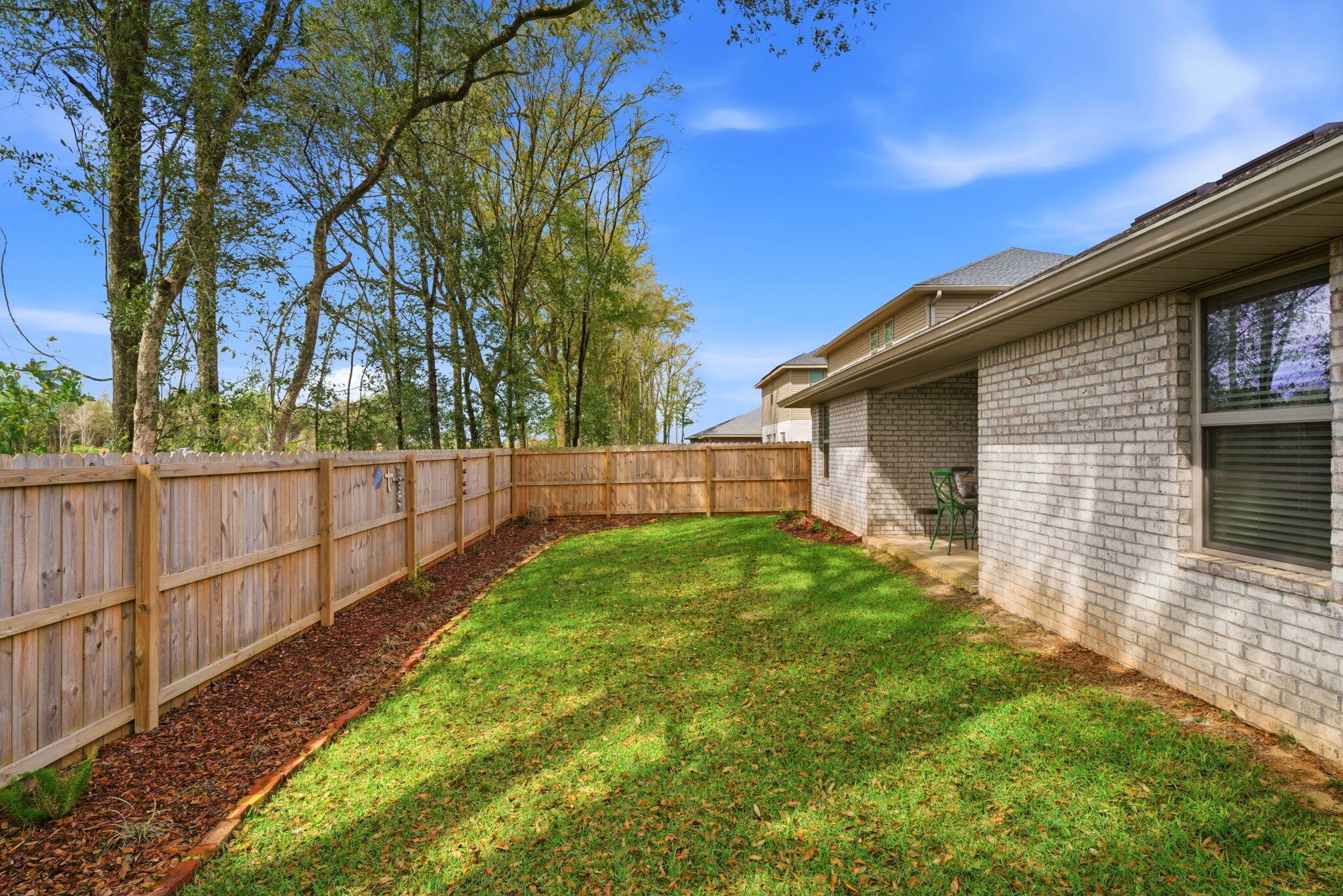 142 Ridgeway Circle Crestview, FL 32536 - Photo 41 of 41 a view of backyard with wooden fence and large trees