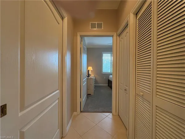 a view of a bathroom from a hallway