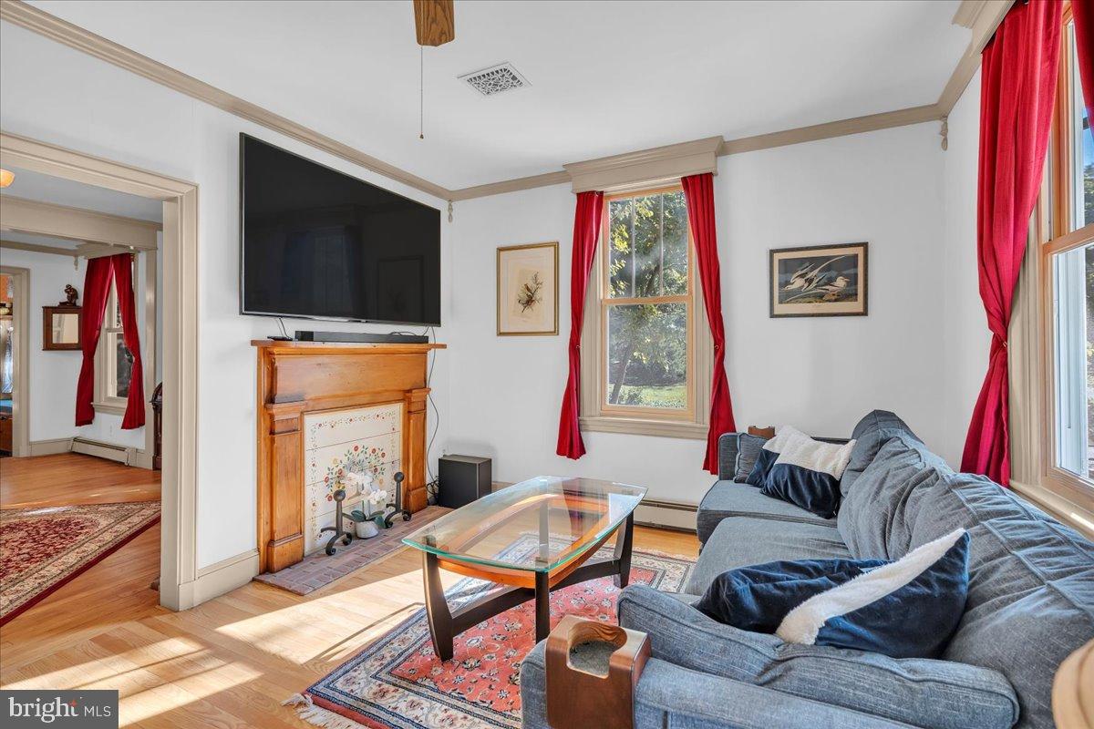56 Main Street Port Republic, NJ 08241 - Photo 12 of 44 a living room with furniture and a flat screen tv