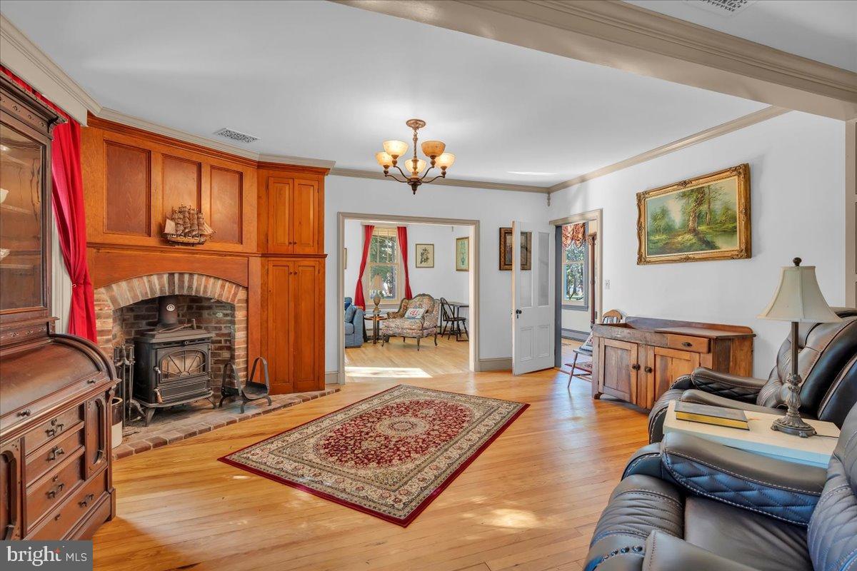56 Main Street Port Republic, NJ 08241 - Photo 13 of 44 a living room with furniture a rug and a fireplace