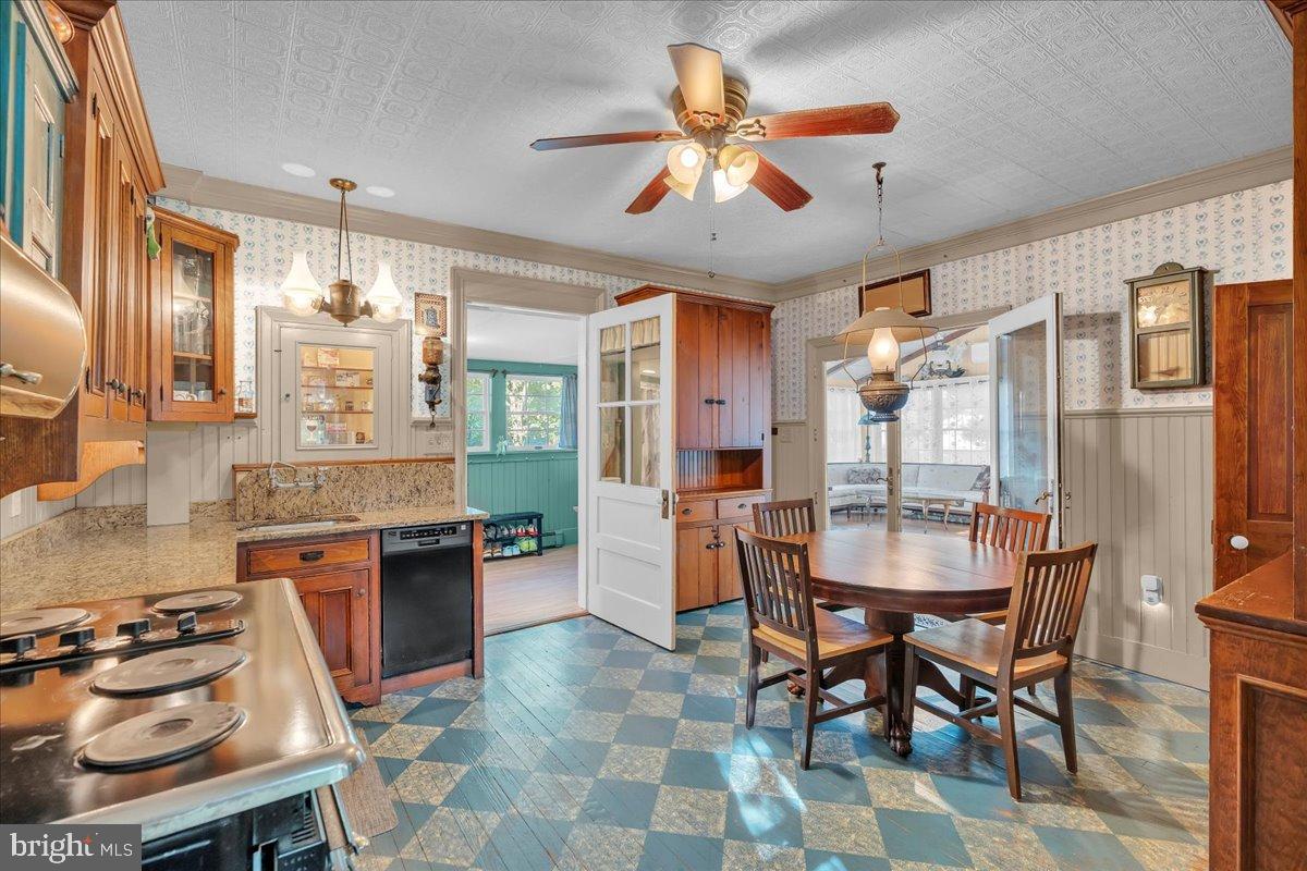56 Main Street Port Republic, NJ 08241 - Photo 16 of 44 a dining table chairs and a kitchen view