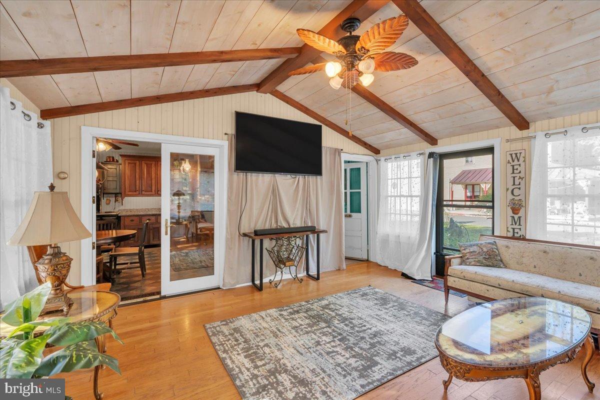56 Main Street Port Republic, NJ 08241 - Photo 19 of 44 a living room with furniture and a rug