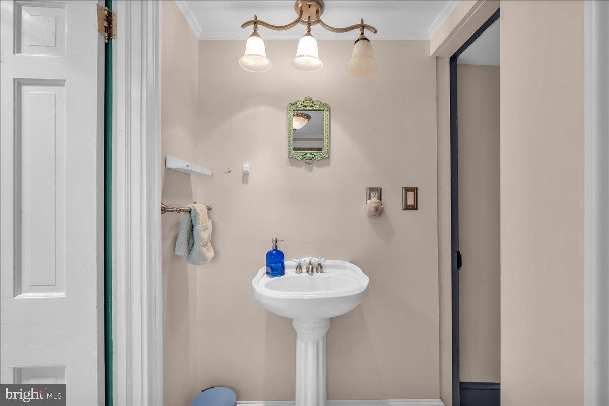 56 Main Street Port Republic, NJ 08241 - Photo 22 of 44 a bathroom with a sink and a mirror