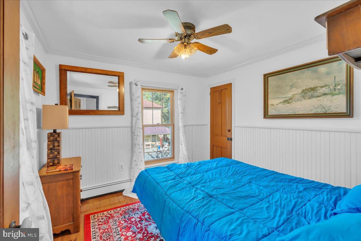 56 Main Street Port Republic, NJ 08241 - Photo 24 of 44 a bedroom with a bed and a window