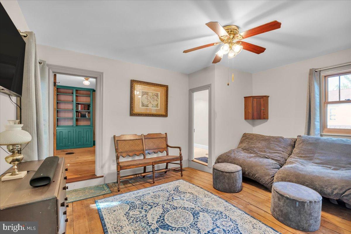 56 Main Street Port Republic, NJ 08241 - Photo 30 of 44 a living room with furniture and a flat screen tv