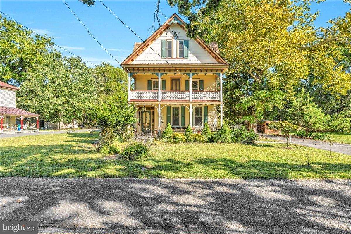 56 Main Street Port Republic, NJ 08241 - Photo 3 of 44 a front view of a house with a yard