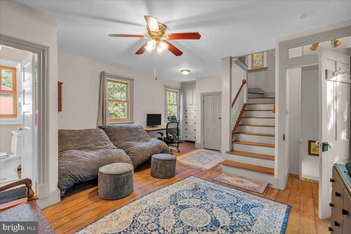 56 Main Street Port Republic, NJ 08241 - Photo 31 of 44 a living room with furniture a rug and a chandelier